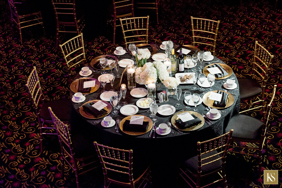 Atheneum Wedding Reception in Detroit table setting with gold chargers